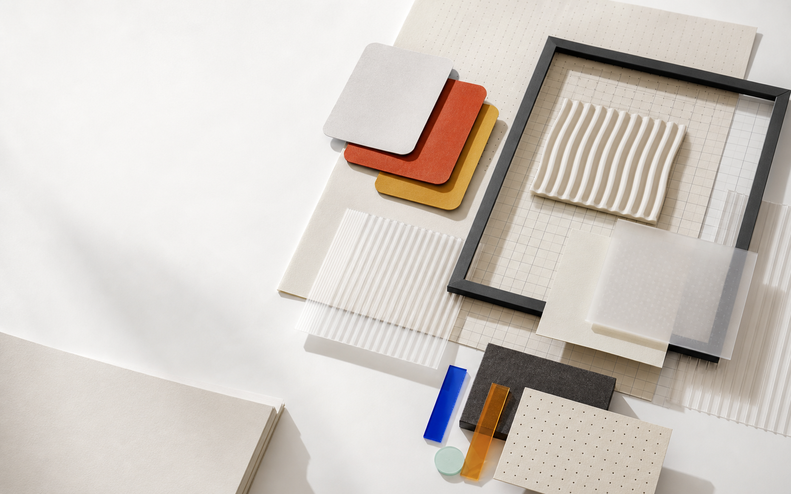 Abstract design studio materials arranged as a tactile color and composition study